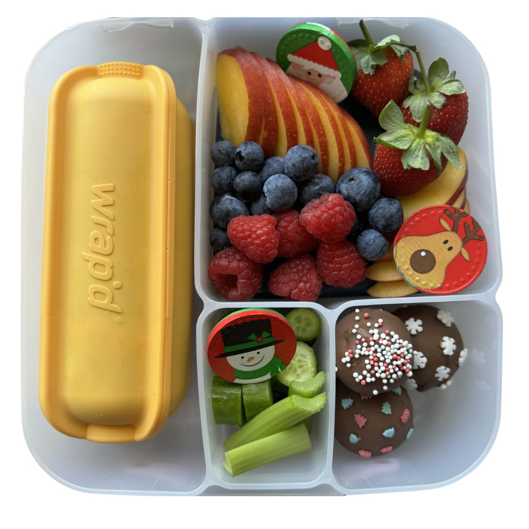 Sunshine Wrap'd in lunchbox with fresh fruit