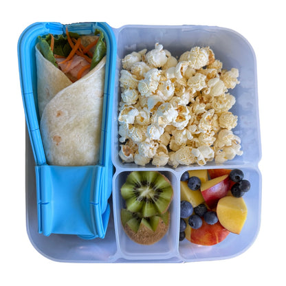 Fresh wrap and snacks inside lunchbox